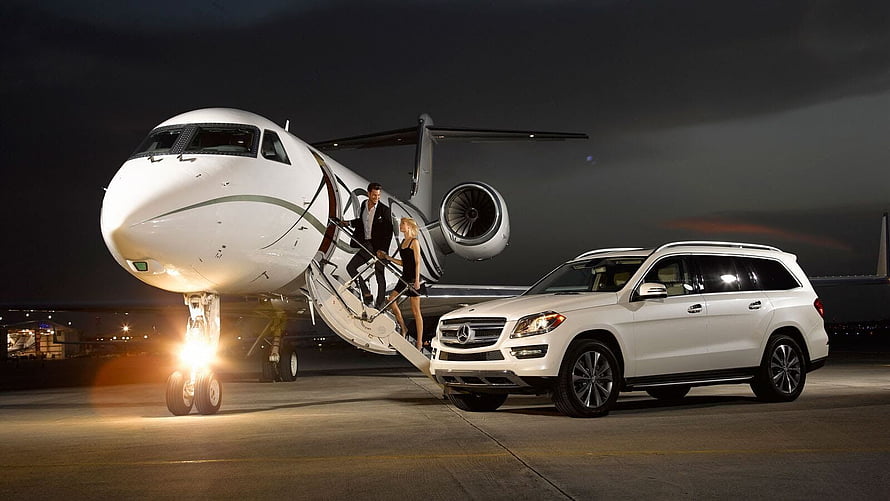 Luxury Private Jet and White SUV on Nighttime Airport Tarmac HD wallpaper