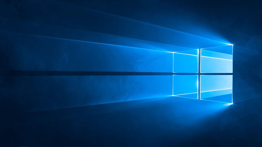 Windows 10 Default Blue Window Logo with Light Rays on Dark Background HD wallpaper