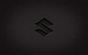 Suzuki carbon fiber emblem on dark textured background HD wallpaper