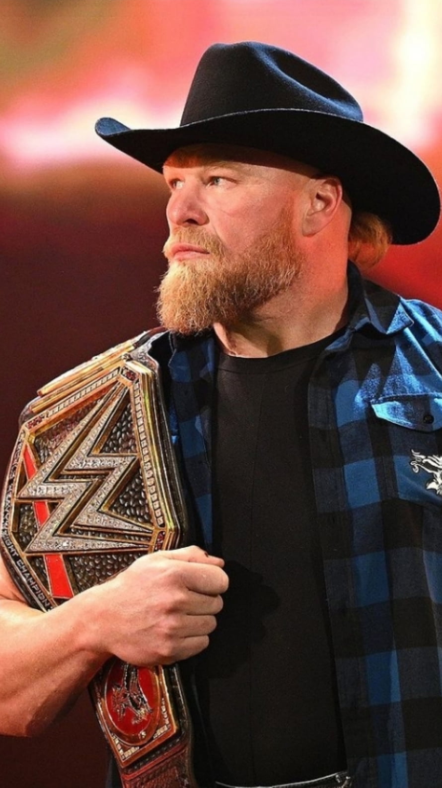 Brock Lesnar in Cowboy Hat and Plaid Shirt Holding WWE Championship Belt HD phone wallpaper