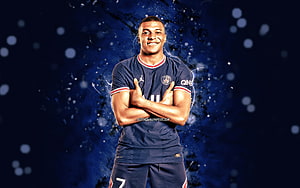 Kylian Mbappe in Paris Saint-Germain Kit with Crossed Arms Against Dark Blue Background HD wallpaper
