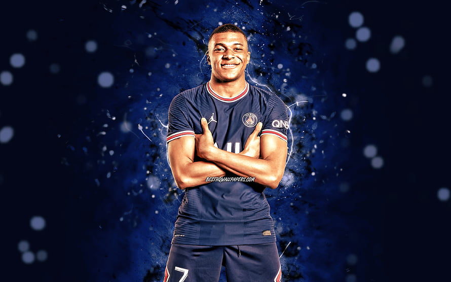 Kylian Mbappe in Paris Saint-Germain Kit with Crossed Arms Against Dark Blue Background HD wallpaper
