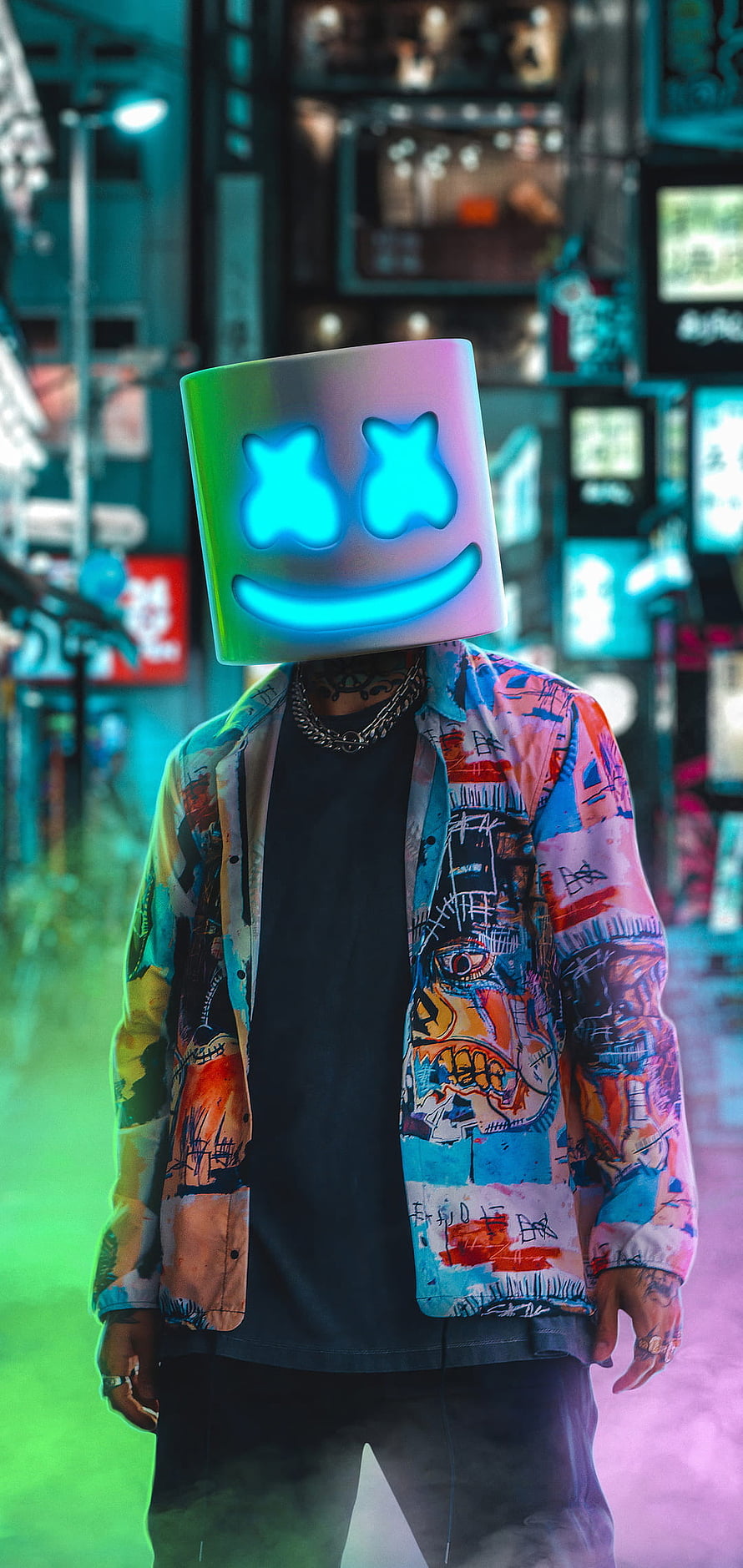 Marshmello in a colorful graffiti jacket standing in a neon-lit urban street at night HD phone wallpaper