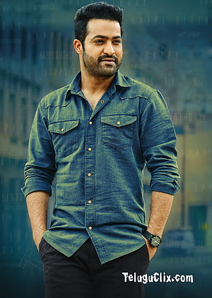 JR NTR in a blue denim shirt with a confident pose and subtle smile HD phone wallpaper