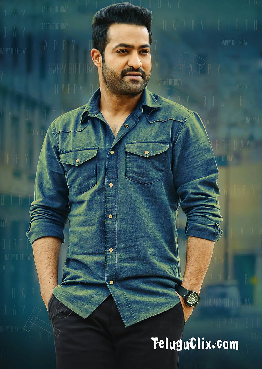 JR NTR in a blue denim shirt with a confident pose and subtle smile HD phone wallpaper