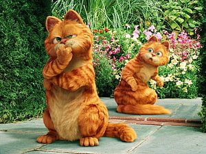 Garfield and Odie in a Vibrant Garden Scene from the Animated Film HD wallpaper