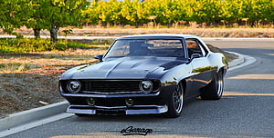 Black Chevrolet Camaro Classic Muscle Car Parked on a Scenic Road HD wallpaper