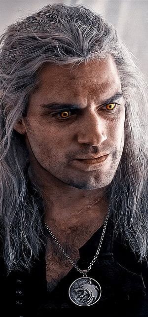 Geralt of Rivia Portrait with Glowing Amber Eyes and Wolf Medallion HD phone wallpaper