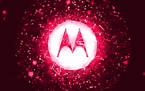 Glowing Motorola M Logo Set Against a Vibrant Pink Abstract Particle Background HD wallpaper