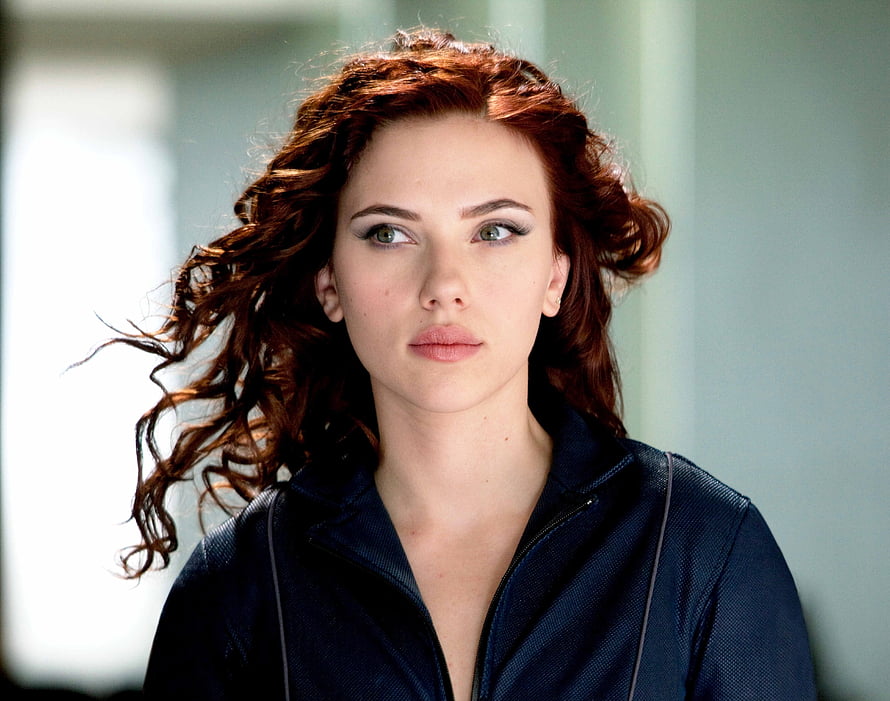 Scarlett Johansson as Black Widow in a dark jacket with windswept red hair HD wallpaper