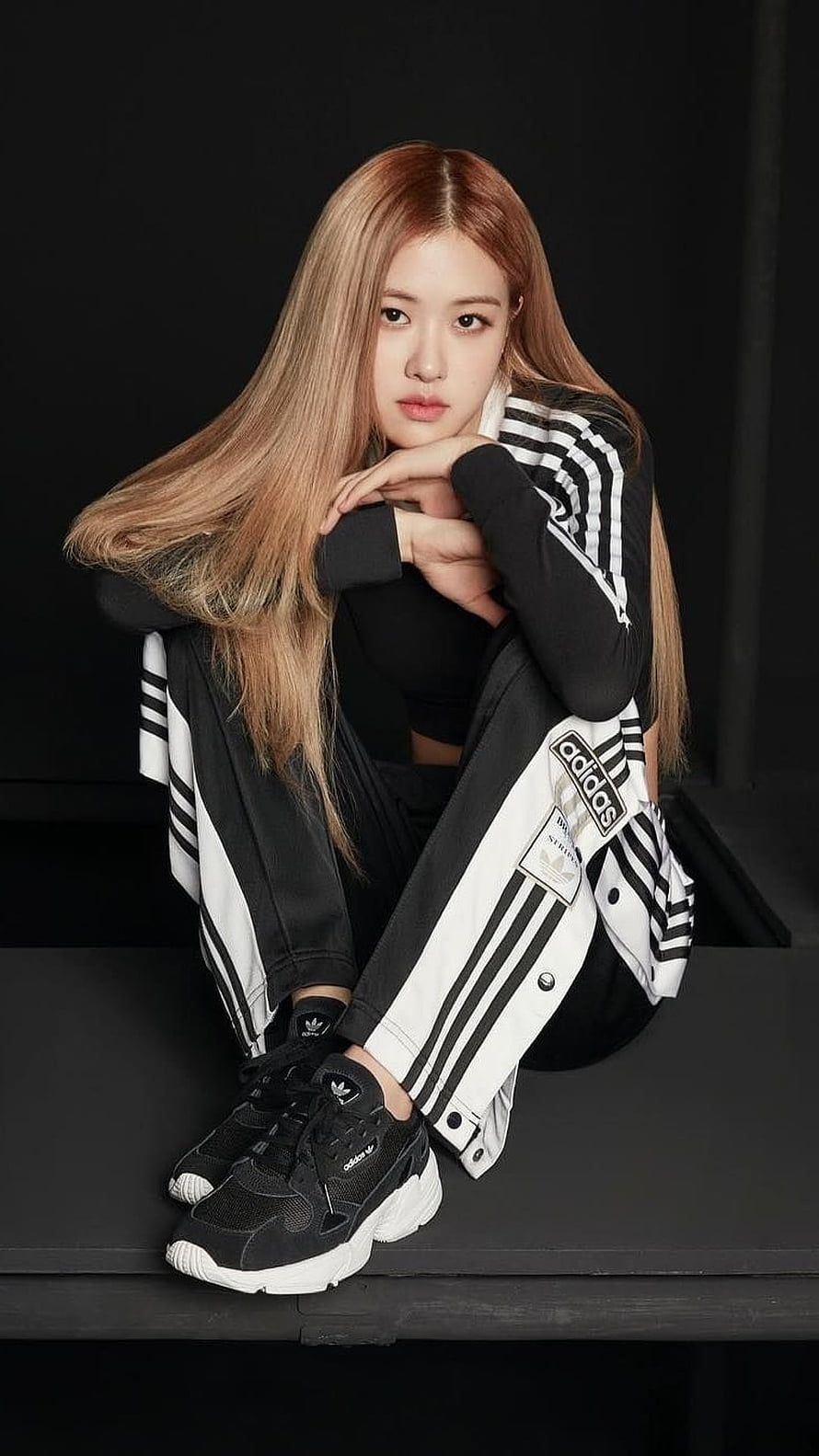 Rose from Blackpink in Adidas Streetwear Sitting on a Dark Studio Platform HD phone wallpaper