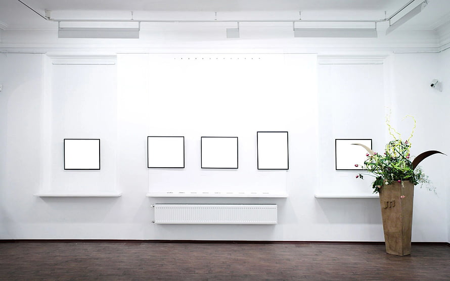 Minimalist White Gallery Interior With Empty Frames And Floral Arrangement HD wallpaper