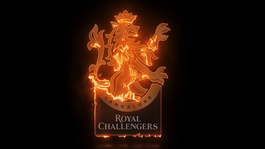 Royal Challengers Bangalore Crest with Fiery Orange Glow on Black Background HD wallpaper