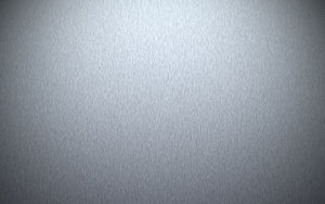 Minimalist brushed silver metal texture with soft radial light gradient and subtle grainy surface detail HD wallpaper