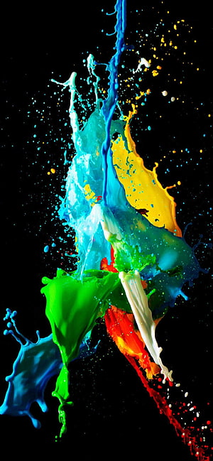 Vibrant multicolored paint splash frozen in motion against a black background HD phone wallpaper