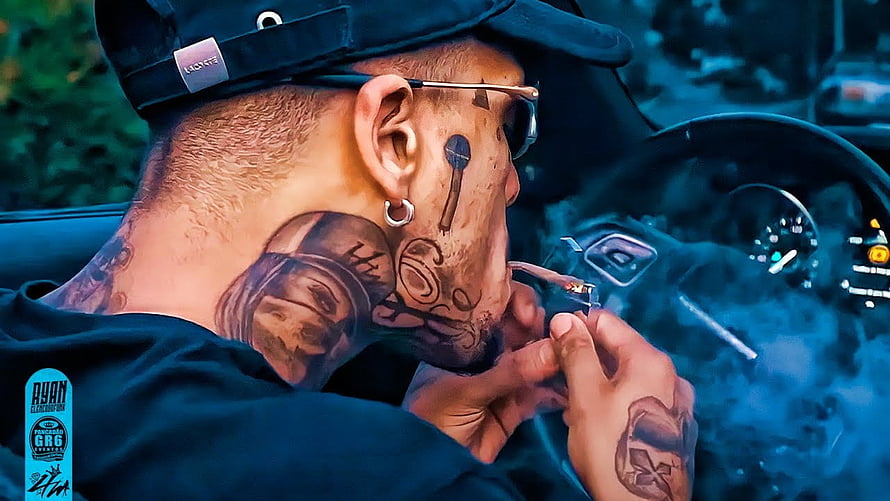 MC Kevin Smoking Cigar in Car with Face and Neck Tattoos HD wallpaper