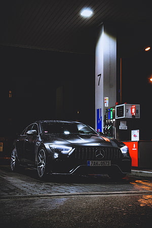 Black Mercedes-AMG GT Coupe Parked at a Gas Station at Night in the Rain HD phone wallpaper