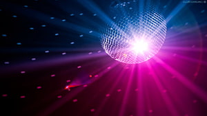 Vibrant disco ball with radiant pink and blue light beams in a dark club setting HD wallpaper