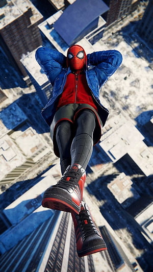 Spider-Man in Blue Jacket and Red Sneakers Floating Above Snowy City Rooftops HD phone wallpaper