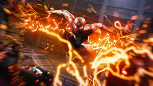 Miles Morales in Dynamic Action Pose Surrounded by Electric Energy and Sparks HD wallpaper