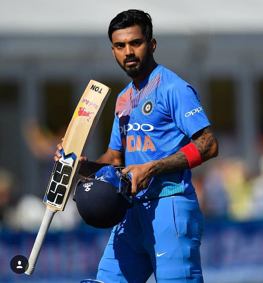 KL Rahul in India Cricket Team Blue Jersey Holding Bat and Helmet on the Field HD phone wallpaper