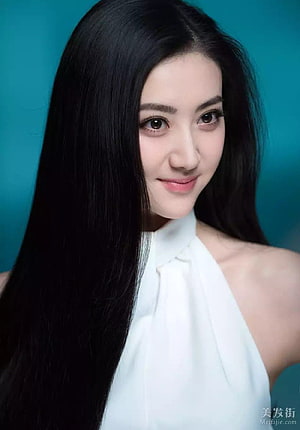 Jing Tian Portrait With Long Black Hair And White Halter Top Against Teal Background HD phone wallpaper