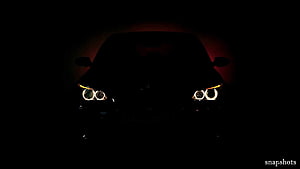 BMW M5 E60 Front Headlights Glowing in Darkness with Red Underglow HD wallpaper
