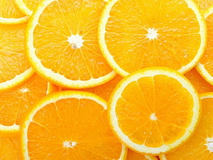Vibrant Sliced Oranges Arranged in a Dense Overlapping Pattern HD wallpaper