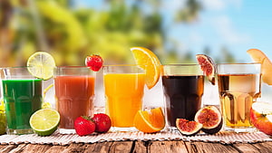 Colorful Fresh Fruit Juices With Citrus And Berries On Rustic Wooden Table HD wallpaper