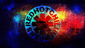 Red Hot Chili Peppers Starburst Logo on Vibrant Cosmic Nebula Background HD wallpaper
