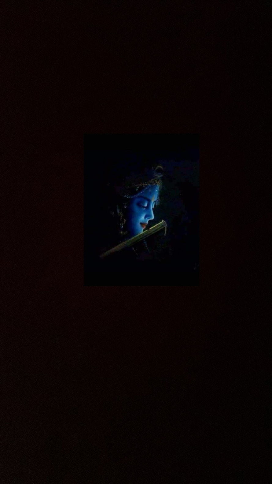 Krishna Playing Flute in Dark Blue Tones with Ornate Headpiece and Serene Expression HD phone wallpaper
