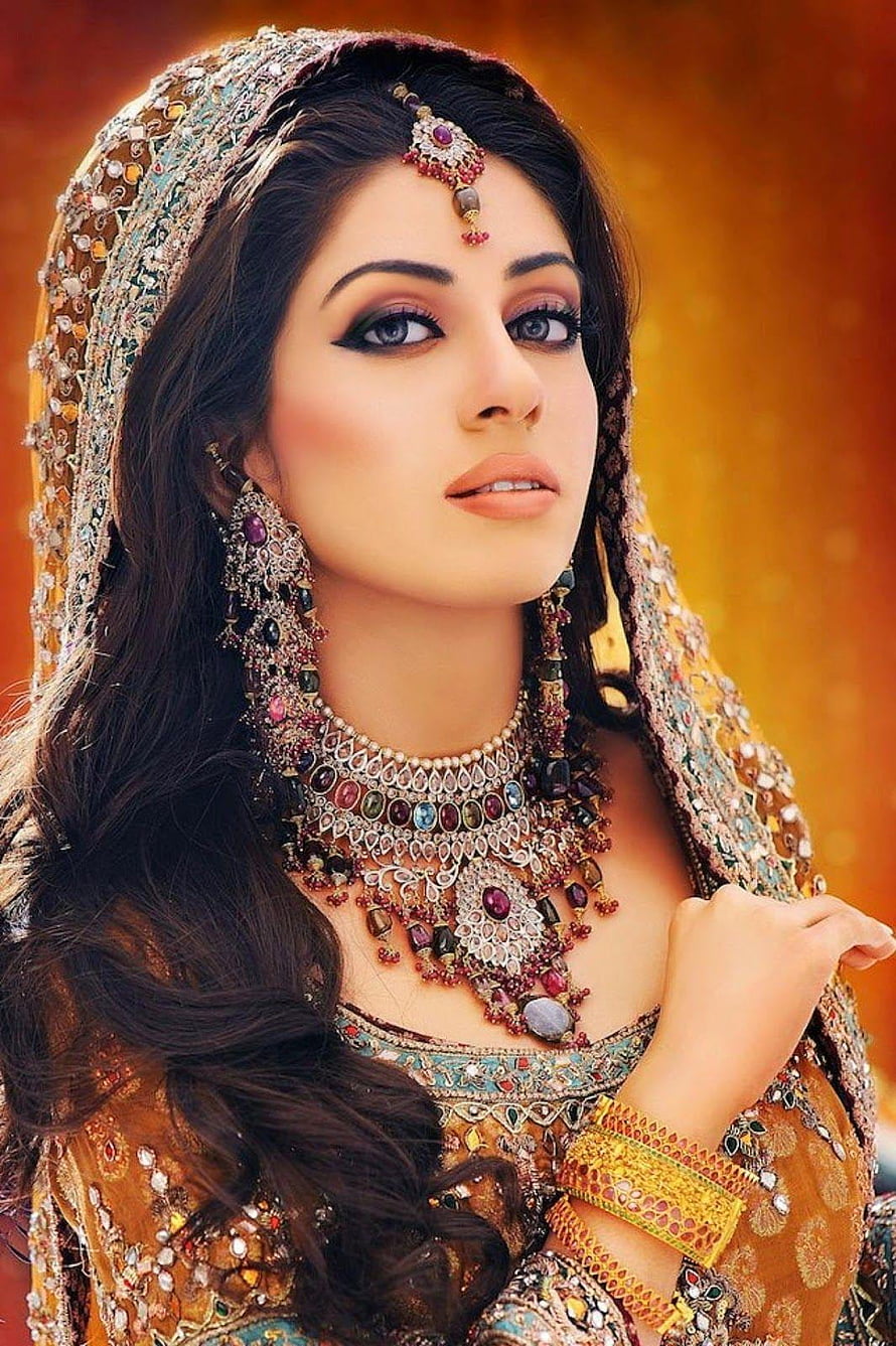 Elegant Indian Bride in Traditional Bridal Attire with Ornate Jewelry and Embroidered Lehenga HD phone wallpaper
