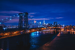 Manhattan Bridge and New York City Skyline at Night with Deep Blue Twilight Sky HD wallpaper