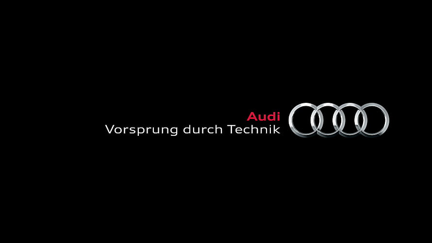 Audi Four Rings Logo with Vorsprung durch Technik Slogan on Black Background HD wallpaper