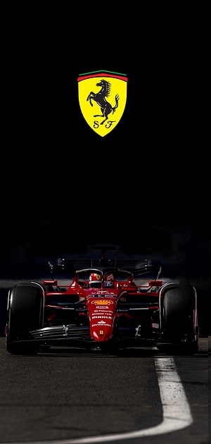 Ferrari Formula 1 race car on track with iconic prancing horse logo HD phone wallpaper