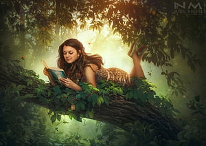 Young Woman Reading a Book on a Mossy Tree Branch in a Sunlit Fantasy Forest HD wallpaper