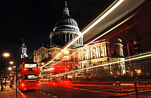 St Paul's Cathedral and a red double-decker bus in London at night with long-exposure light trails HD wallpaper