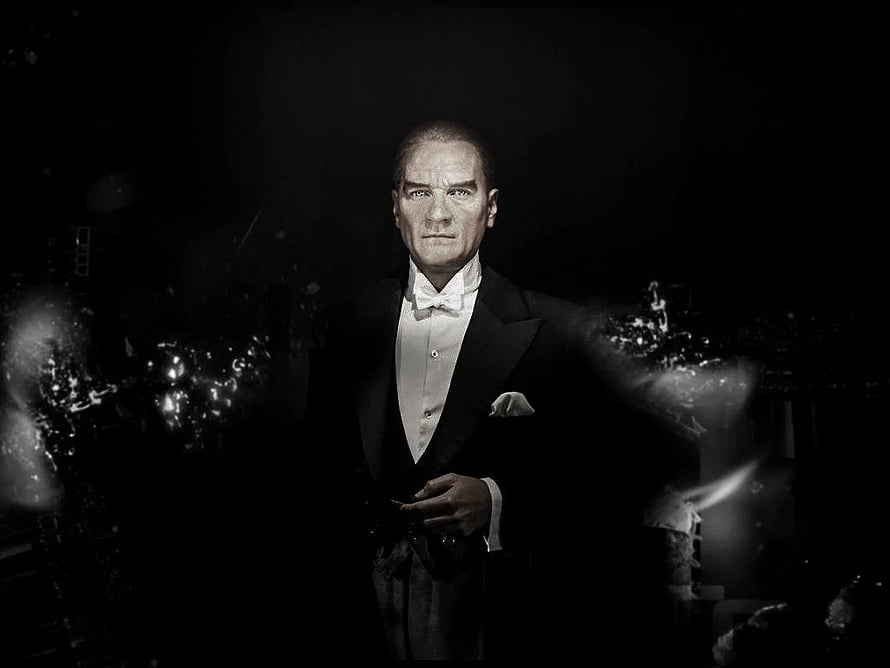 Mustafa Kemal Ataturk in Formal Black Tie Attire with Dramatic Dark Background HD wallpaper