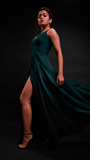 Rashmika Mandanna in an elegant emerald green gown with a dramatic high slit HD phone wallpaper