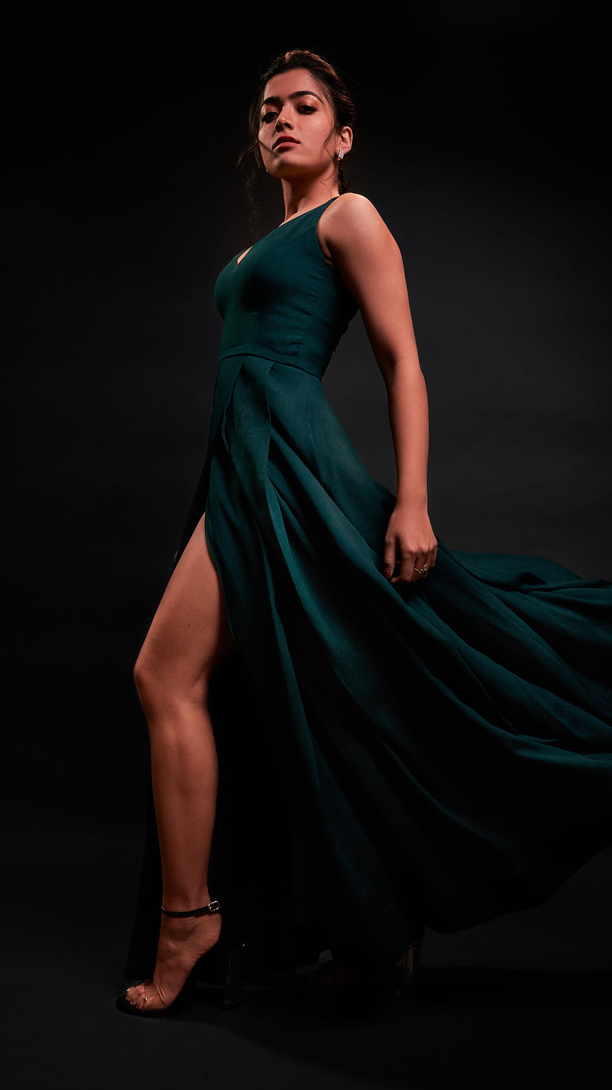 Rashmika Mandanna in an elegant emerald green gown with a dramatic high slit HD phone wallpaper