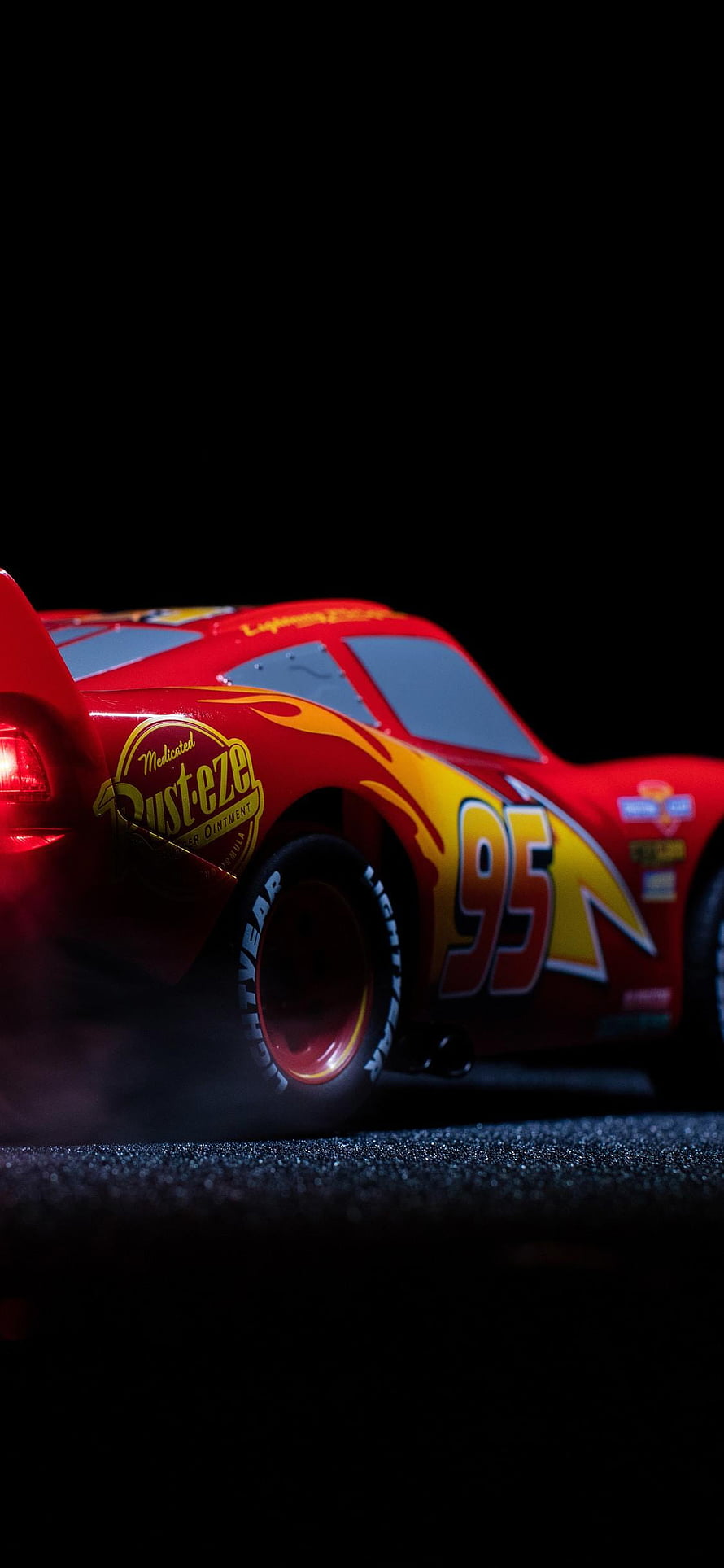 Lightning McQueen Number 95 Rust-eze Racing Car Close-Up on Dark Track HD phone wallpaper