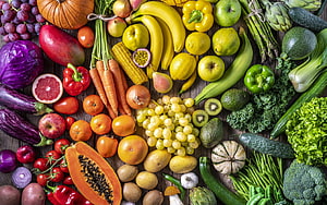 Vibrant Rainbow of Fresh Fruits and Vegetables Arranged on Rustic Wooden Surface HD wallpaper