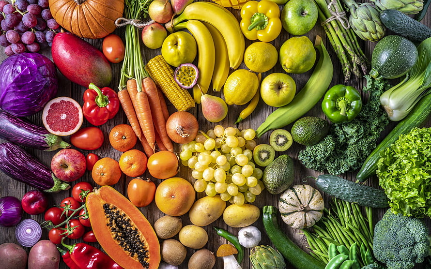 Vibrant Rainbow of Fresh Fruits and Vegetables Arranged on Rustic Wooden Surface HD wallpaper