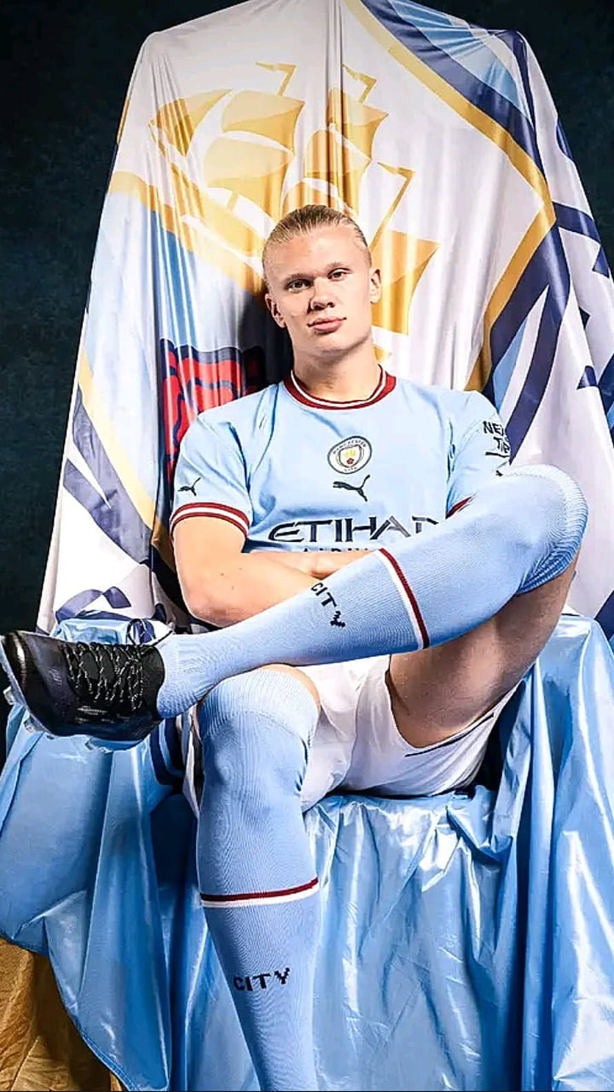 Erling Haaland in Manchester City Home Kit Seated on Throne with Club Crest HD phone wallpaper