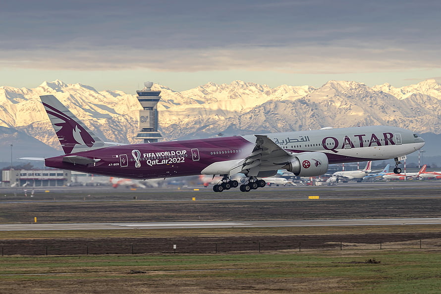 Qatar Airways Boeing 777 with FIFA World Cup 2022 Livery Taking Off Against Snowy Mountains HD wallpaper