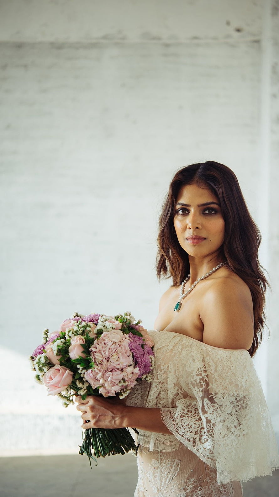 Malavika Mohanan in Elegant Bridal Lace Gown Holding Floral Bouquet HD phone wallpaper