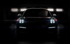 Porsche 911 GT3 R Front View With Glowing Headlights In Dark Garage Setting HD wallpaper