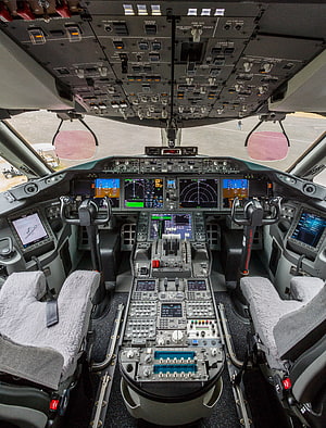 Boeing 787 Dreamliner Cockpit Interior with Digital Flight Deck Displays and Control Panels HD phone wallpaper