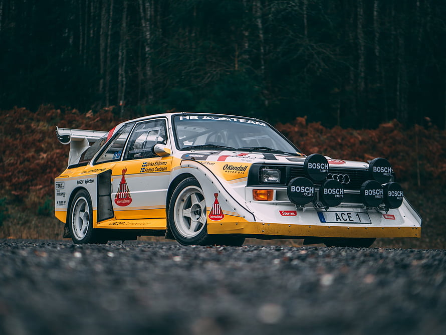 Audi Sport Quattro S1 E2 Rally Car on Gravel Stage with Bosch Sponsors HD wallpaper
