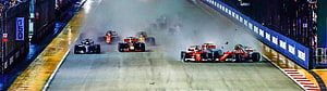 Formula 1 Night Race on Wet Track with Ferrari and McLaren Cars HD wallpaper